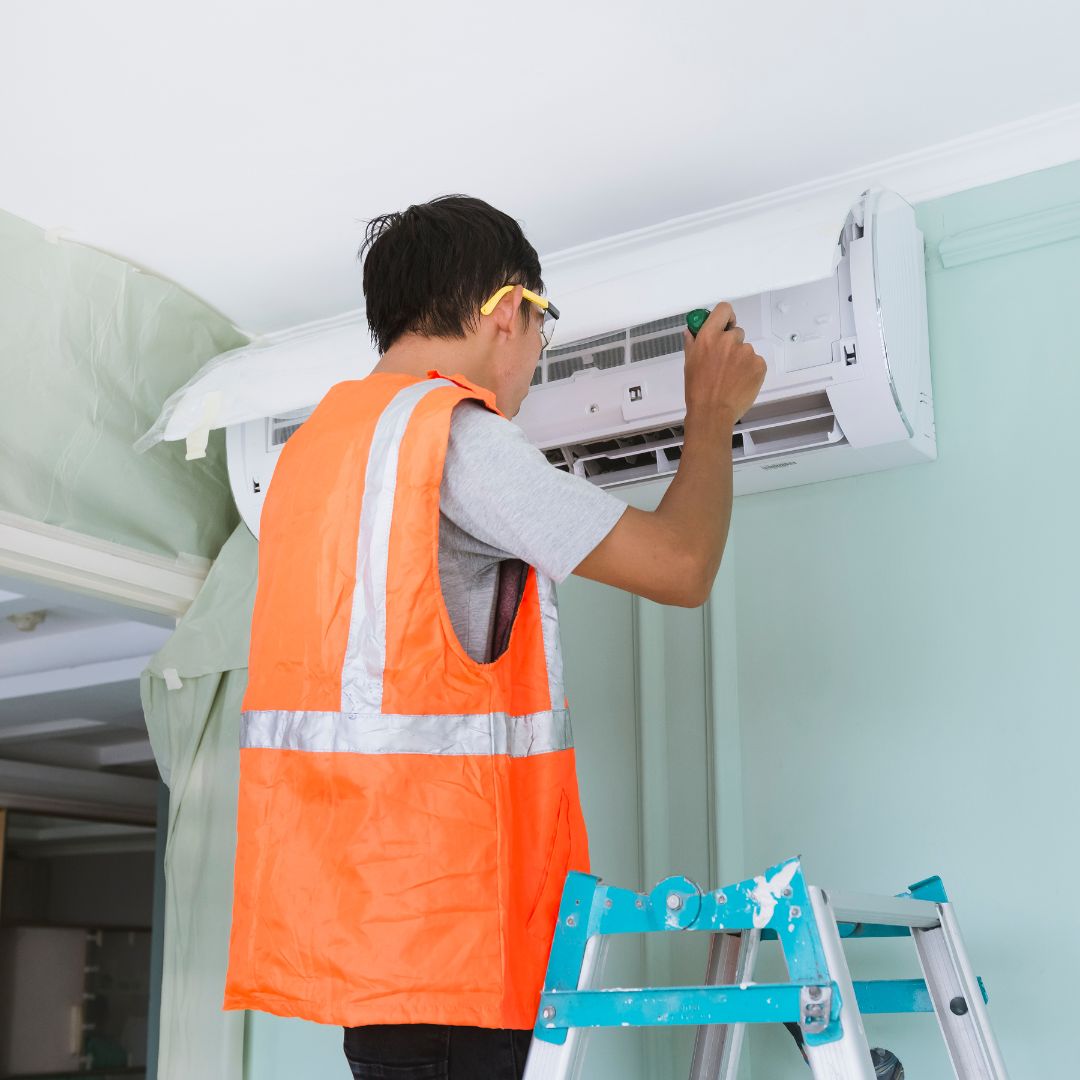 ac technition fixing air conditioner