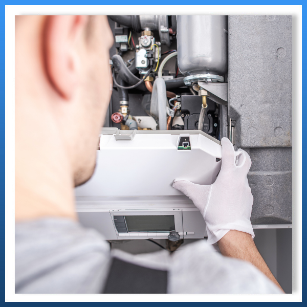 hvac technician installing heating system
