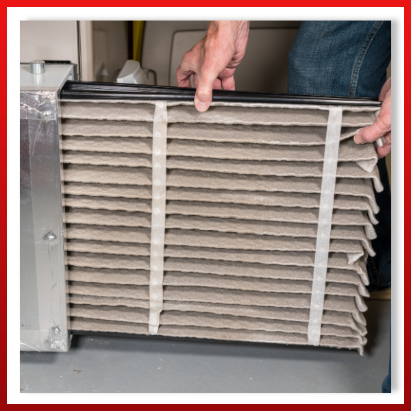 technician replacing air filter