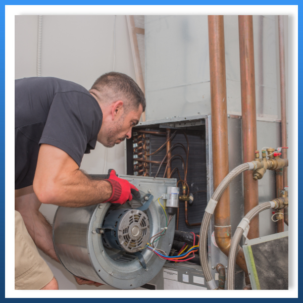 technician working on furnace repair