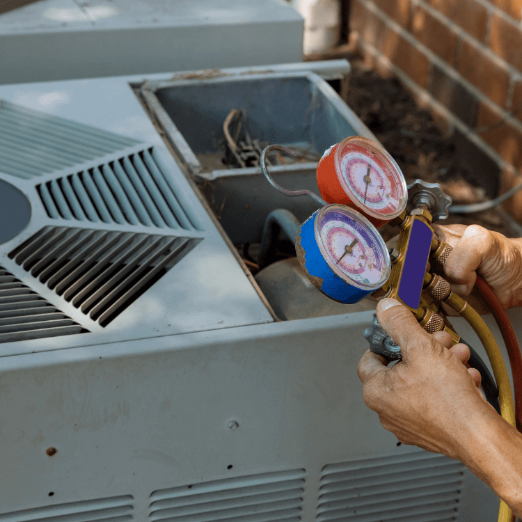 person testing air conditioner with tools